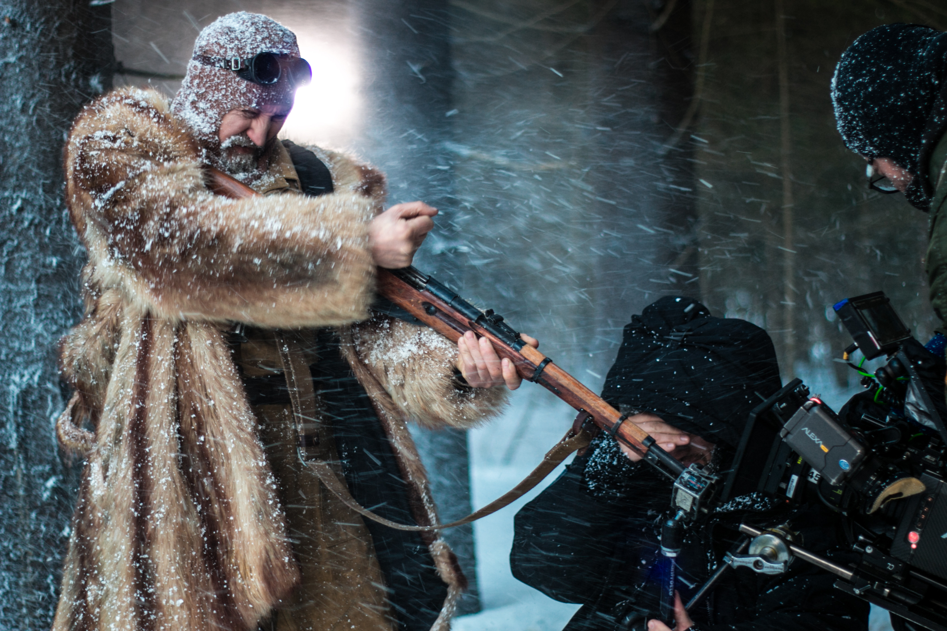 Behind the camera during a snow-filled period film scene