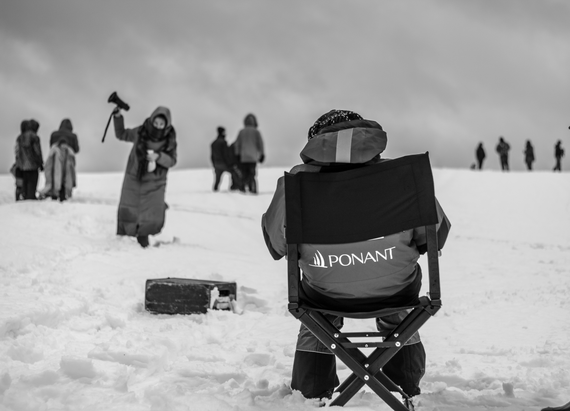 Film crew resting in the snow during an Arctic set
